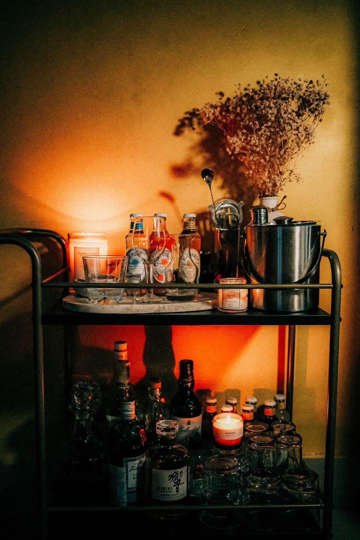 Cane Bar Cart, full view, styled with glassware